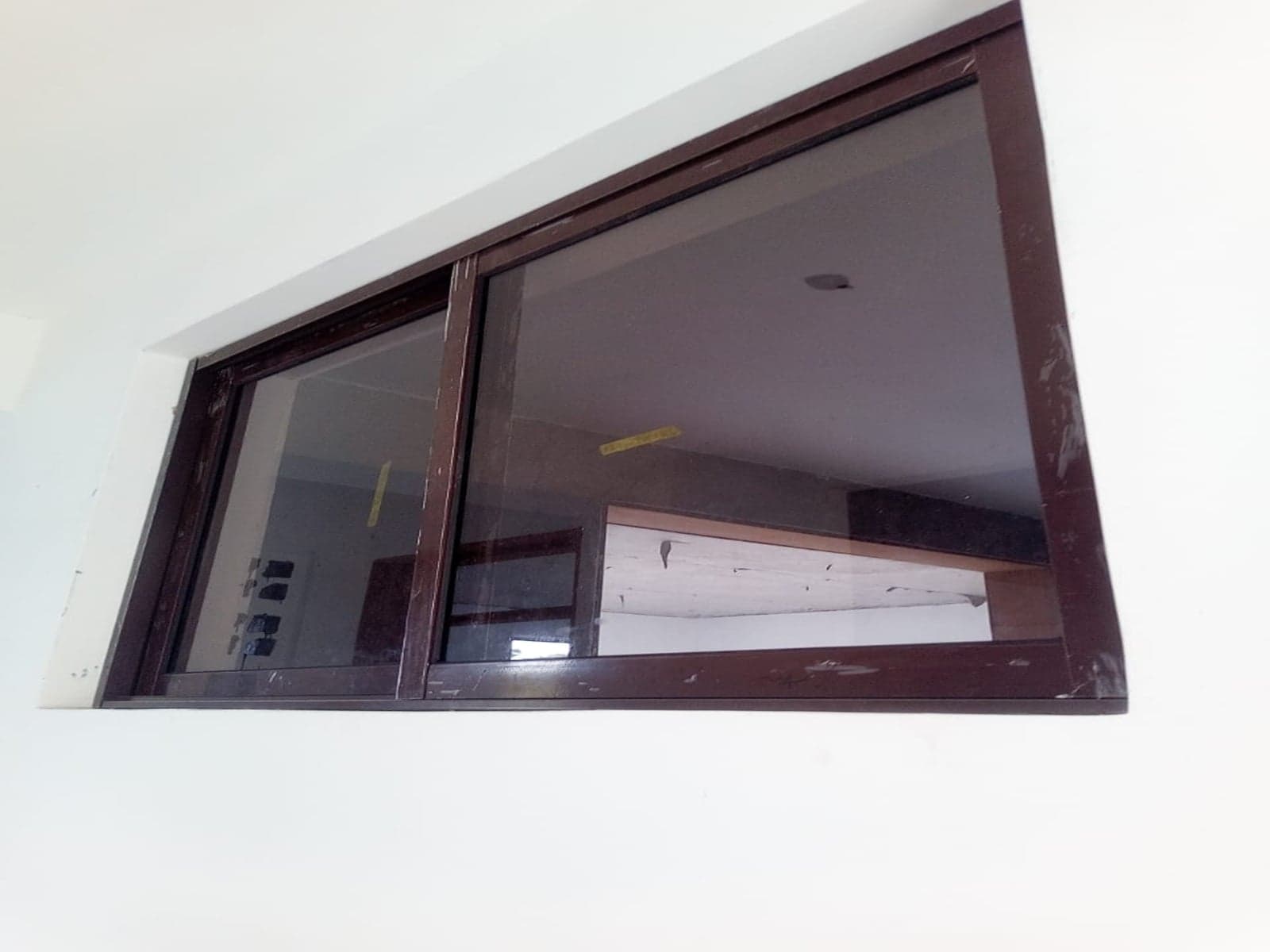 2 Panel Sliding window on a brown profile and clear glass